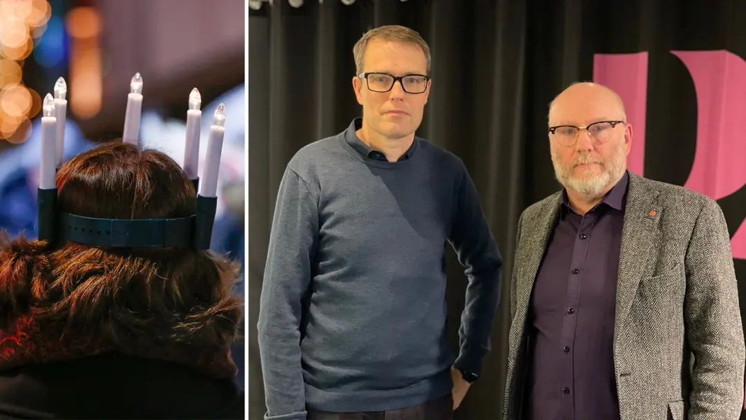 Till vänster en lucia, vänd från kameran, med mörkt långt hår och luciakrona på huvudet. Till höger två medelålders män i glasögon, som står vända mot kameran.