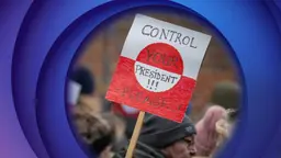 The greenlandic flag on a poster carried during a demonstration with greenlanders and danes in Copenhagen this week.