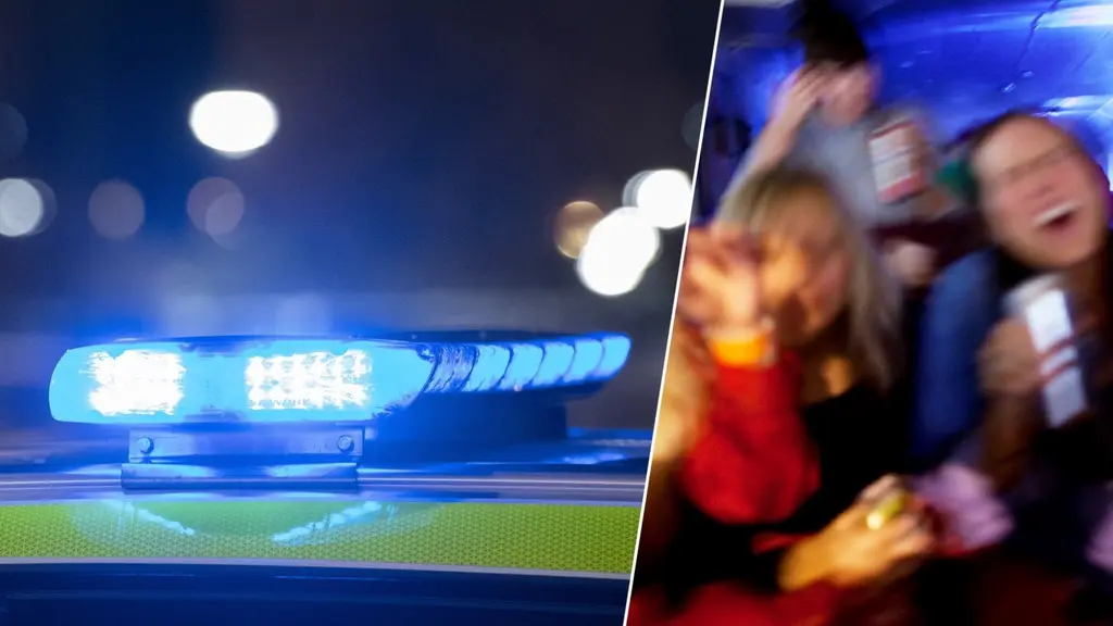 Tak på polisbil med blåljus tända i mörker